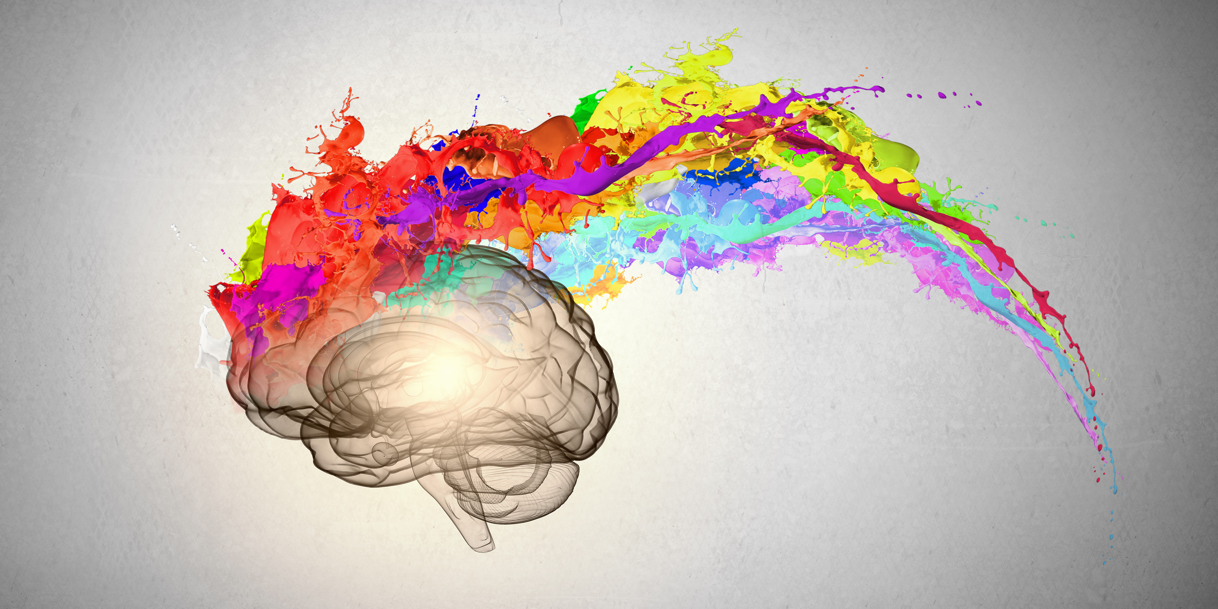 a brain showing creativity - paint coming out of the brain